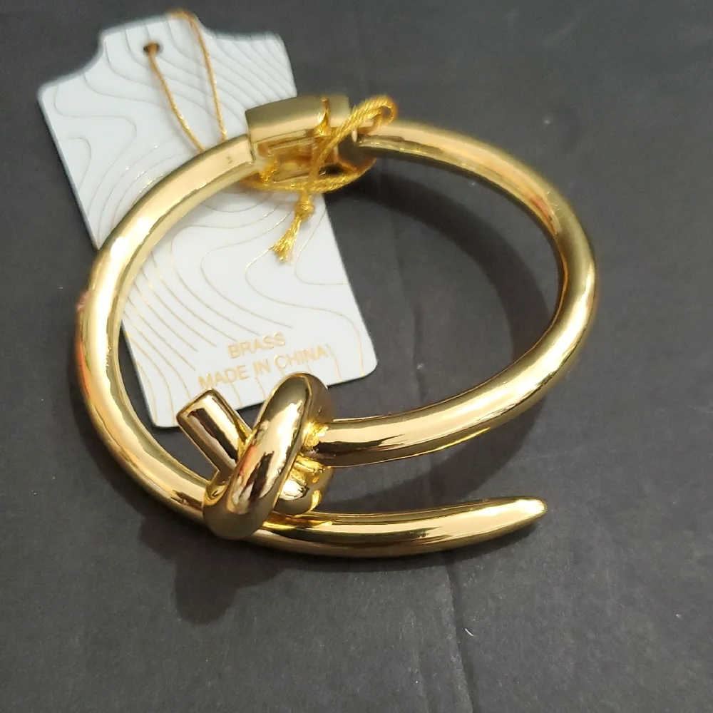 Eye Candy gold tone knot and point open‎ cuff hinged bracelet bangle brand new